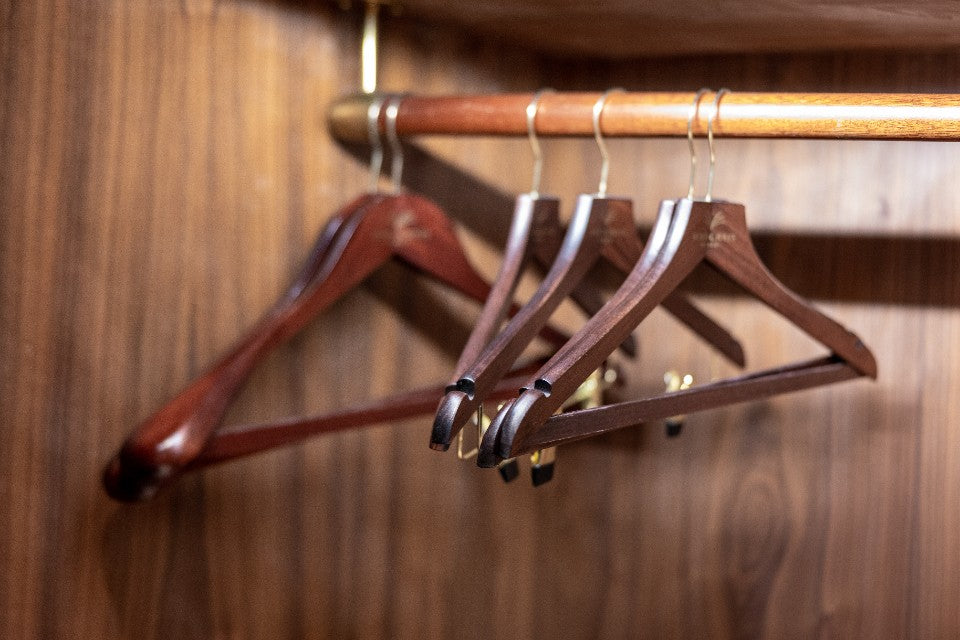 Warm wooden hangers for choosing comfortable clothing on a sensitive gut day