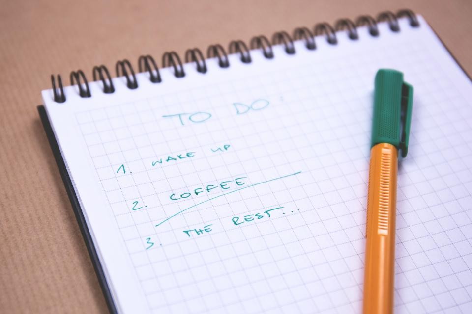 Simple to-do list on a desk for keeping holiday weekend plans flexible