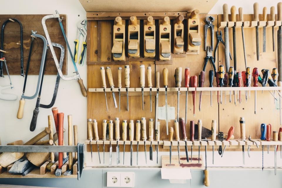 Organized wall of home-repair tools for planning a service visit