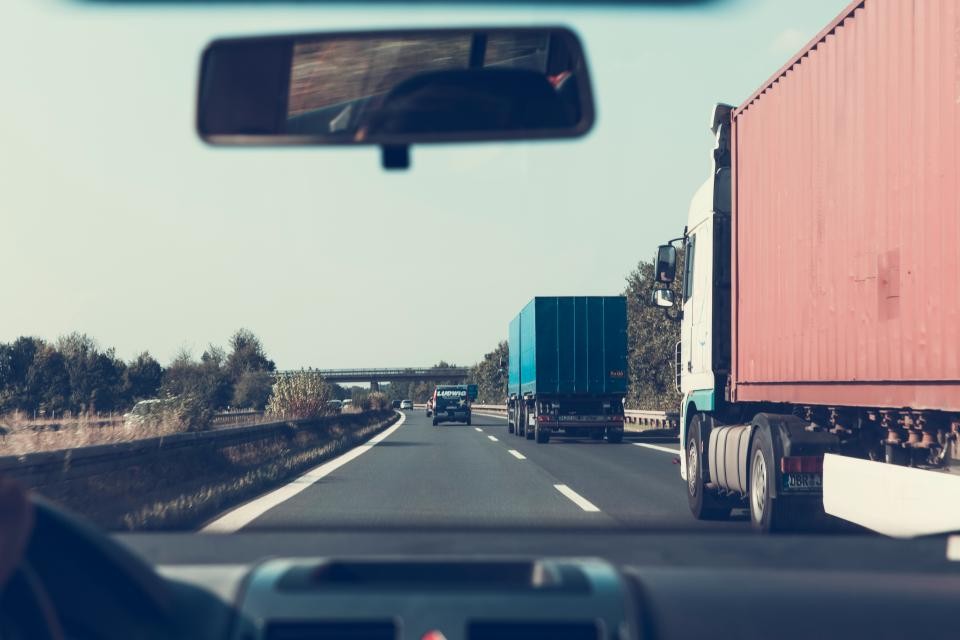 View through a car windshield on a highway for planning a more flexible long ride