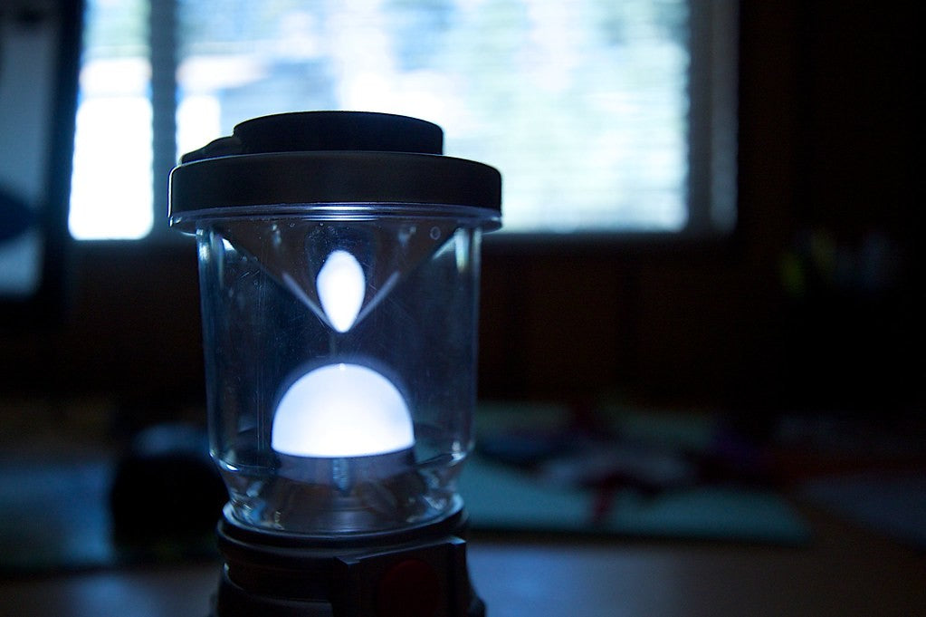 Battery lantern lighting a dark room during a power outage
