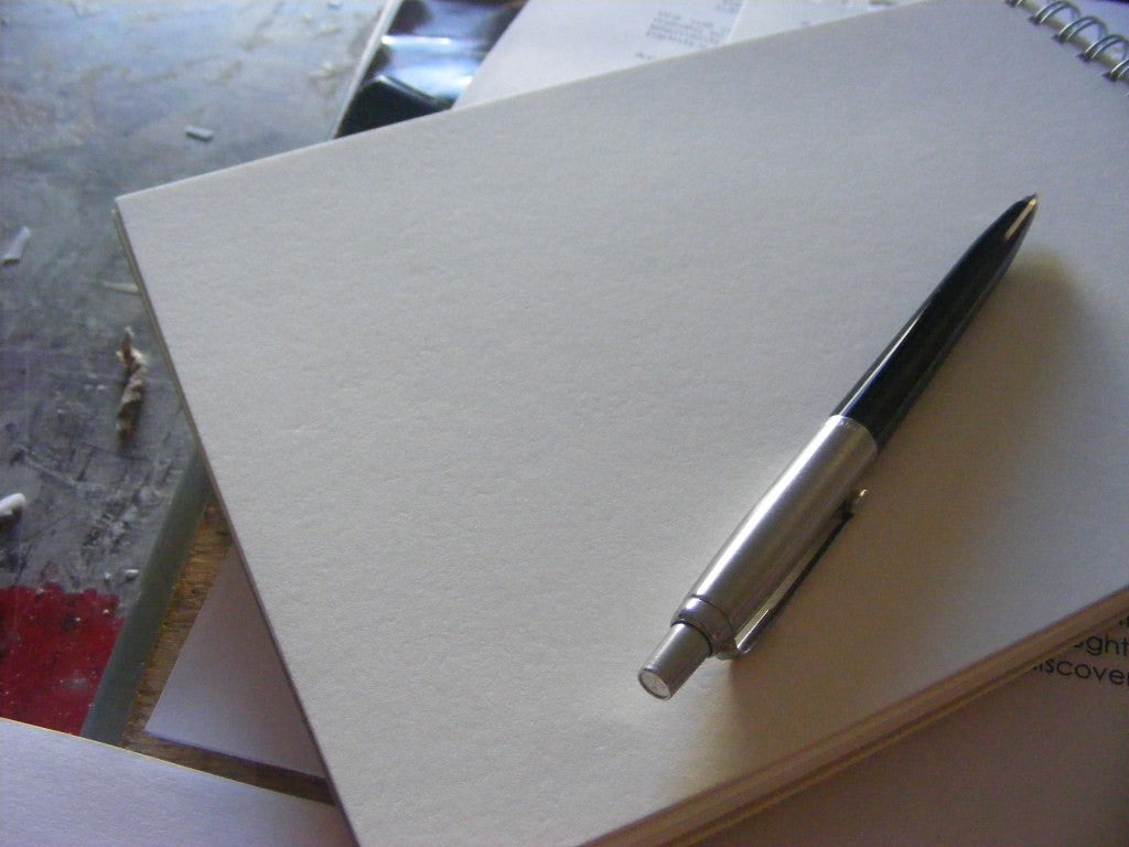 Pen and blank paper for a quiet evening check-in without tracking every detail