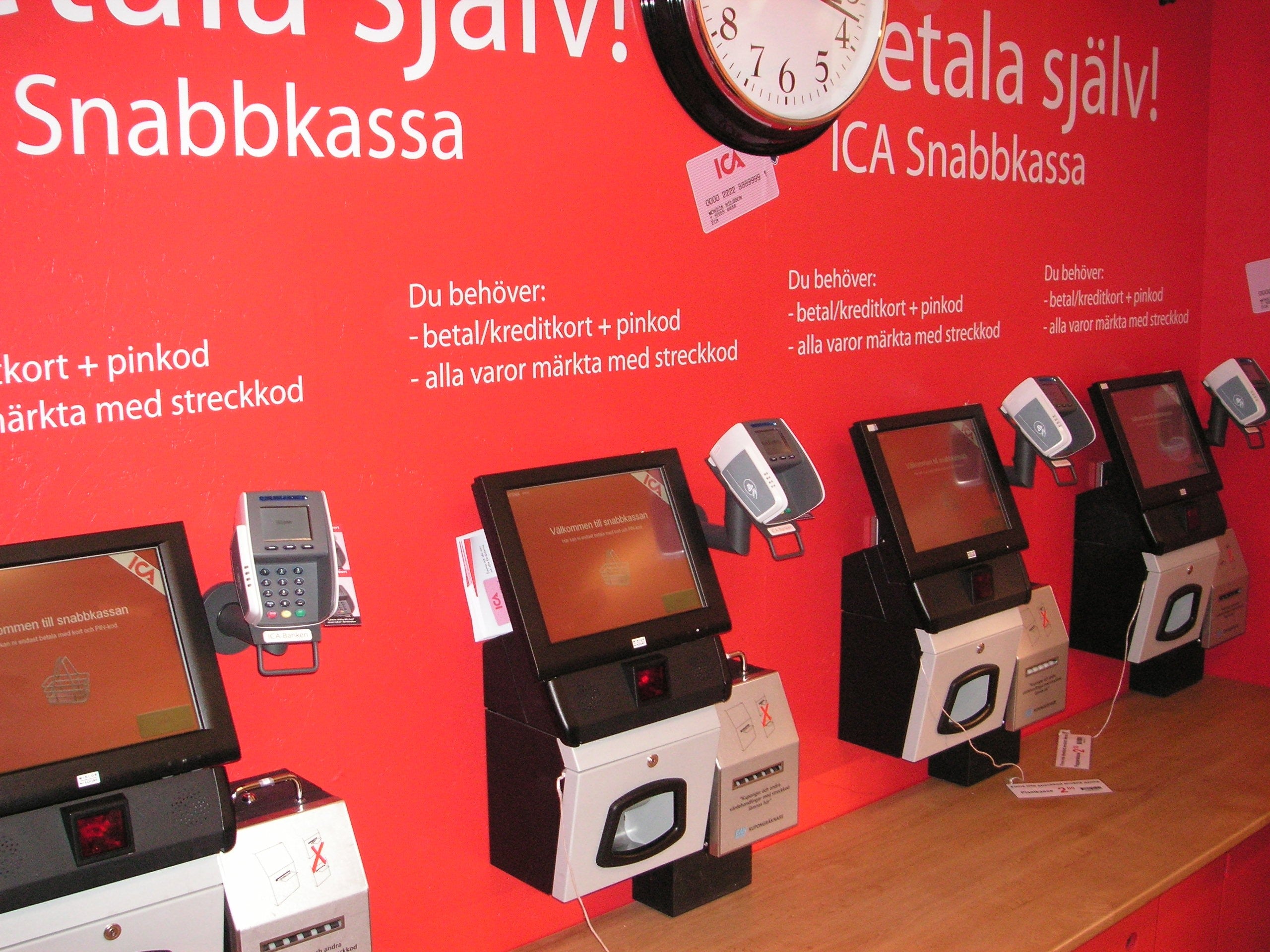 Row of self-checkout stations offering one possible way to finish a shopping trip