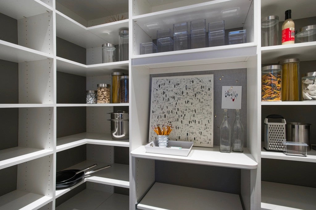 Organized pantry shelves with simple kitchen staples for a lower-pressure food routine