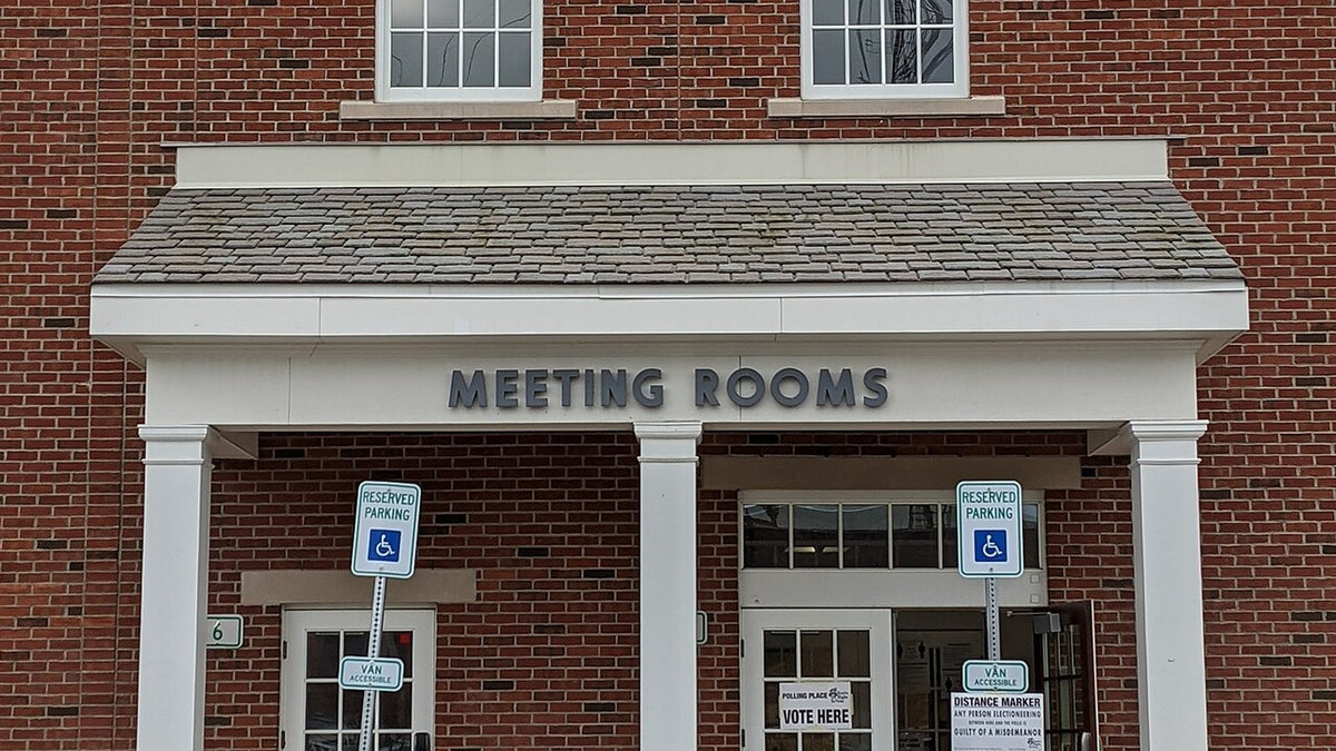 Entrance to a polling place with posted voting signs