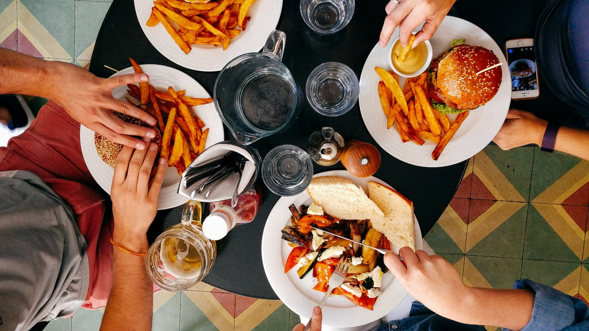 Friends sharing lunch together at a table
